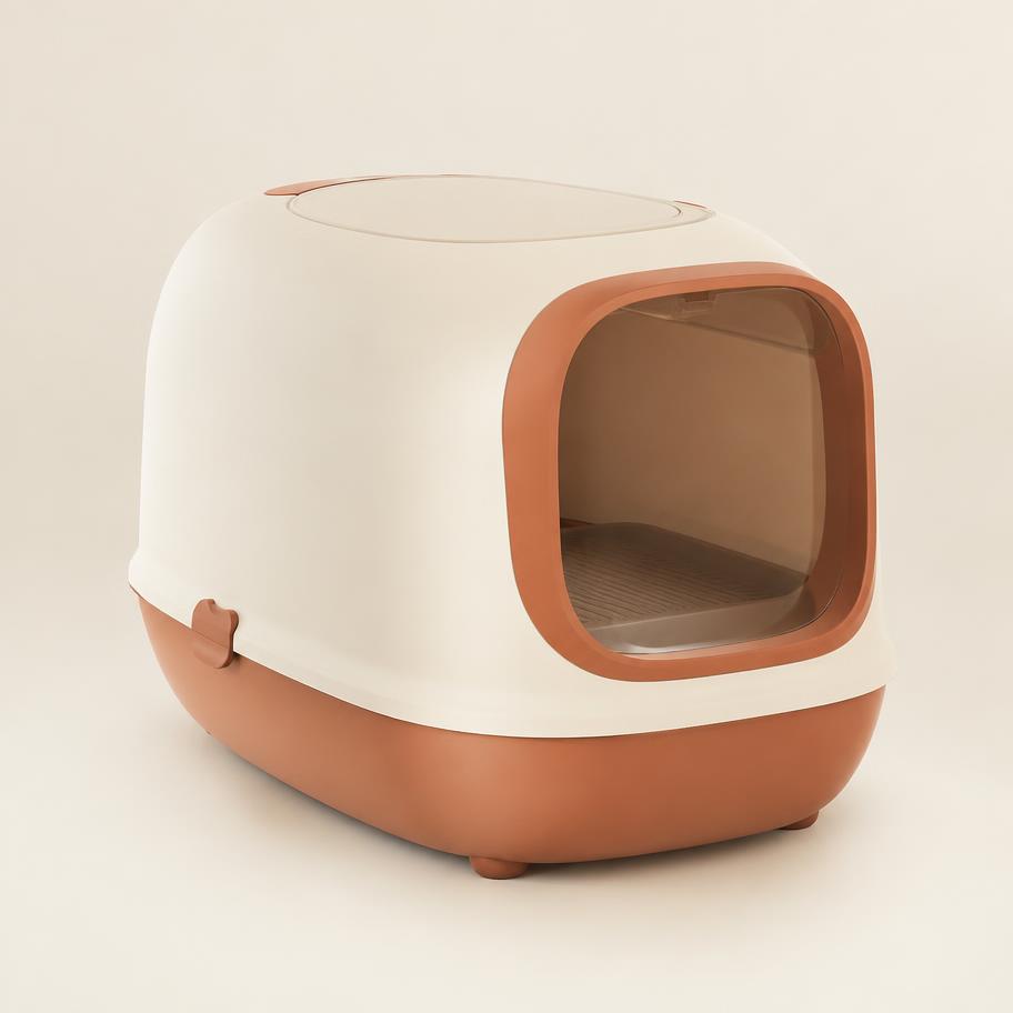 PurrBox litter box seen from a three-quarter angle in cream and terracotta